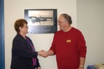 Sen. Lyda Green exchanges a warm handshake with Port Commission Chairman John Riggs.