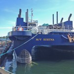 Ferry in water, stern view.