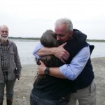 River erosion activist Pat Huddleson hugs Homeland Security's Mike O'Hare