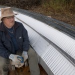 Warren Templin is busy bolting the roof together.