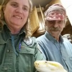 Mat-Su Animal Care Officer Darla Erskine shown wincing some at Sam's approach. Sam is a 17-foot, 100-pound python that can squeeze you to death or sink in teeth if you are considered prey.