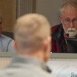 Assembly Members George Mckee, left, and Jim Sykes, right, asking questions of Eric Oien of Denali Timber Management