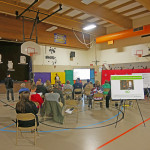 Mat-Su Borough Planner Brianne Blackburn presents to crowd of 45 at Butte Elementary School on air quality.