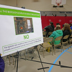 Residents looked at poster boards before listening to two presentations and a question and answer session.